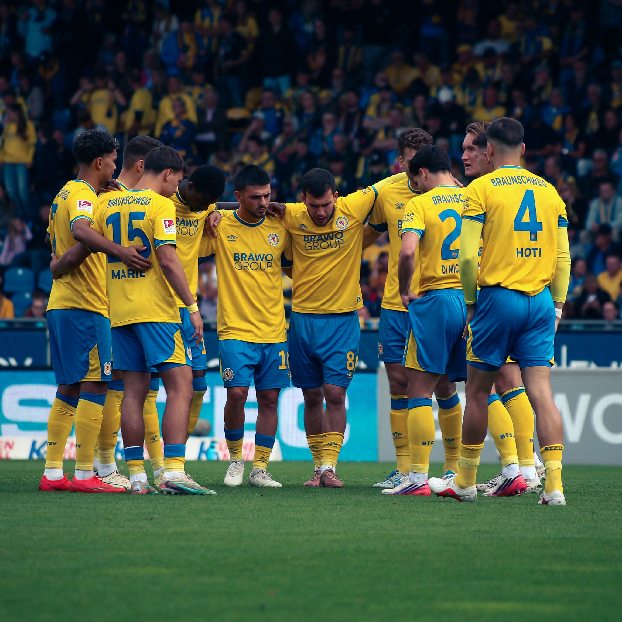Eintracht Braunschweig players gather before the 2. Bundesliga match against Dynamo Dresden at the Eintracht-Stadion.