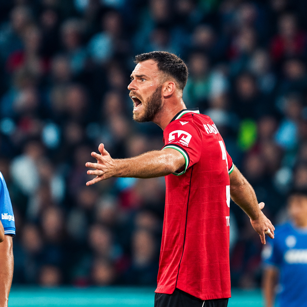 A Hannover 96 player calls to teammates during the match against Karlsruher SC in Hannover.